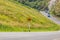 Warning steep road sign slope and truck on hill