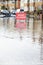 Warning Traffic Sign On Flooded Road