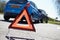 Warning Triangle By Two Cars Involved In Accident