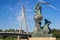 Warsaw Mermaid and Swietokrzyski bridge in Warsaw, Poland