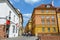 Warsaw Old city. Houses and city wall. Earthworks. Red brick city wall. Small street, Rycerska street, in the medieval old city in