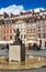 Warsaw, Poland - April 23, 2017: Statue of Mermaid Syrenka - symbol of Warsaw at Old Town Market Square against tenements and re