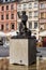 Warsaw, Poland - April 23, 2017: Statue of Mermaid Syrenka - symbol of Warsaw at Old Town Market Square against tenements and re