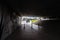 WARSAW, POLAND - FEBRUARY 29, 2020: People seen from behind walking out of the tunnel covered in graffiti near Vistula river in