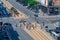 Warsaw / Poland - June.17.2018. View from the top on the city cross road with people crossing the street and traffic. Sunny day.