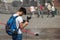 Warsaw, Poland - June 23, 2016. Tourists with steadicam, against the background of a temporary fountain in the capital of Poland.