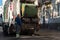 Warsaw, Poland - May 26, 2021: Garbage truck and garbage collection in Warsaw. Lorry with a jack lifting a container. City