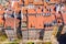 Warsaw, Poland red orange roof in old town market square with historic street town architecture and windows rooftop closeup