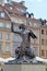 WARSAW, POLAND. A statue of the Warsaw siren against the background of historical buildings