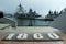 Warships in the bay anchored astern to the pier