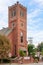 Warwick, NY / United States - Sept. 26, 2020: Vertical image of the red brick iconic Clocktower Building in Warwick. Offices,