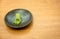 Wasabi, traditional japan herb in black plate on wood table