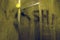 WASH letters on the shower glass-handwritten lettering written on gray stuface with water drops.The inscription on the soap glass