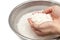 Wash rice with water in the stainless bowl