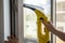 Wash the window at home with a battery wiper. The apparatus yellow collects drops of water and clean the window. Hands scrub the w