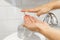 Wash your hands! Applying antibacterial soap rom bottle on hands to prevent coronavirus. Cleaning and disinfecting hands in proper