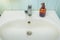 Washbasin with soap accessories/bathroom with washbasin with soap dispenser and cosmetics bottles