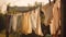 Washed clothes on clothesline drying on rope outside. Generative AI