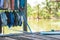 Washed cloths is hanging on wire for drying on wooden floor of T