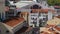 Washed laundry drying on window of small apartment building in heart of Portugal