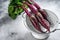 Washed organic purple beetroot in a colander. Gray background. Top view. Copy space