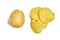 Washed potato lies next to several chips on a white background. The concept of comparing raw and finished product