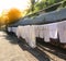 Washed shabby linen along bali street , hanging laundry on the street soft sun rays and soft focus