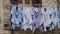 Washed shirts dry on rope under open window. Traditional way of drying laundry