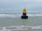 Washed up buoy on the beach of Monster, The Netherlands.