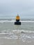 Washed up buoy on the beach of Monster, The Netherlands.