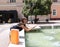 She washes herself with water on a fountain located in the center of Novi Sad. Photo7