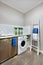 A washing area with a washing machine of a modern house