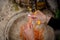 Washing carrot under water women hand