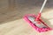 Washing Dust on Wooden Floor with Mop