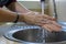 Washing female hands properly. Hygiene concept. Rubbing with soap and water