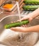 Washing fresh cucumbers in the water under the tap