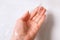 Washing hand over white ceramic sink in bathroom under water stream, close-up. Concept health and body care