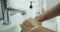 Washing hands man rinsing soap with running water at sink, Coronavirus prevention hand hygiene. Corona Virus pandemic