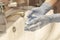 Washing hands in medical gloves under the faucet with water