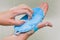 Washing hands with soap. A woman cleans her hands from viruses with a blue brush. Coronavirus prevention, hygiene. Protection from