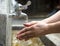 Washing of hands under running water