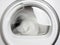 Washing machine porthole closeup working front view