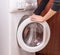 Washing machine with woman hands ,Open