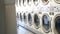 Washing machines, public coin laundry, USA. Self-service laundromat, laundrette.