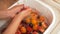 Washing summer fruits, caucasian women