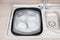 Washing up sink drainer dishes plates cutlery pots pans kitchen neat and tidy
