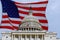 Washington DC Capitol Building on Capitol Hill detail on american flag background