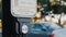 Washington DC, USA, October 2017: A woman presses a button at a traffic light to cross the road