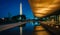 The Washington Monument and National Museum of African American History and Culture at night, in Washington, DC