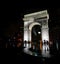 Washington square park arch New York at night in the rain